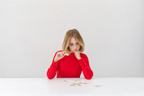 Attractive young girl playing domino