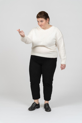 Plus size woman in casual clothes gesturing