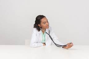 Beautiful female doctor with the stethoscope