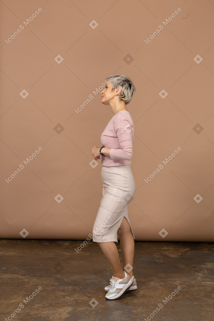 Woman in casual clothes posing in profile