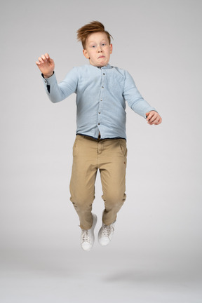A boy jumping in the air