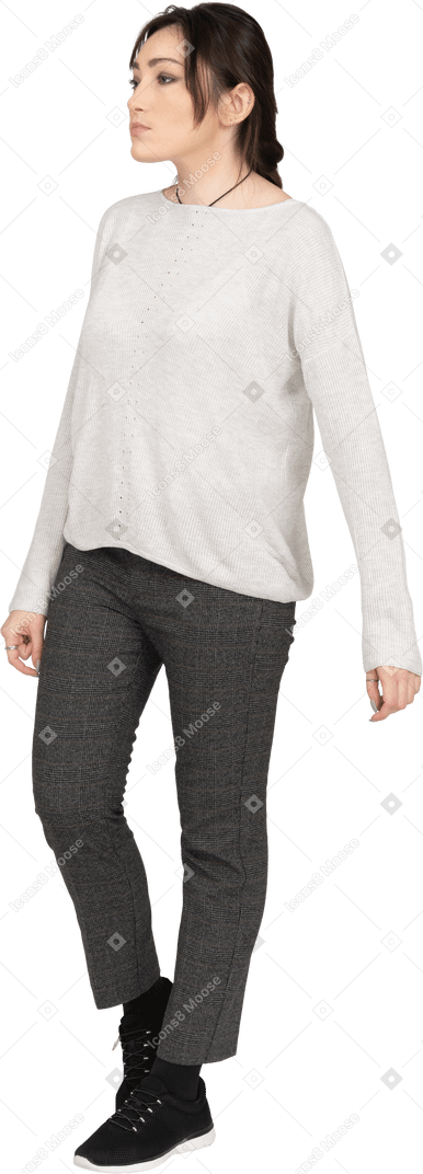 Young woman in casual clothing posing on white background