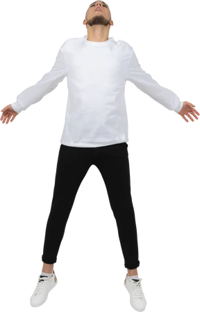 Young man jumping and looking up