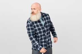 Bearded man looking angrily at someone