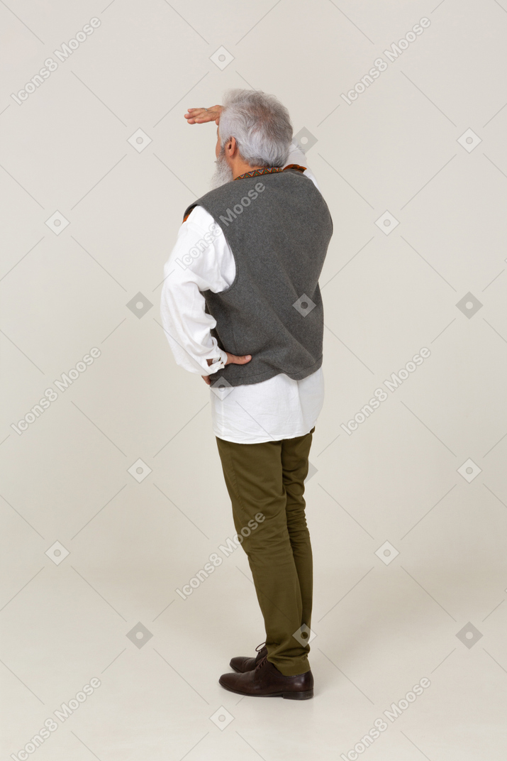 Back view of a man looking afar