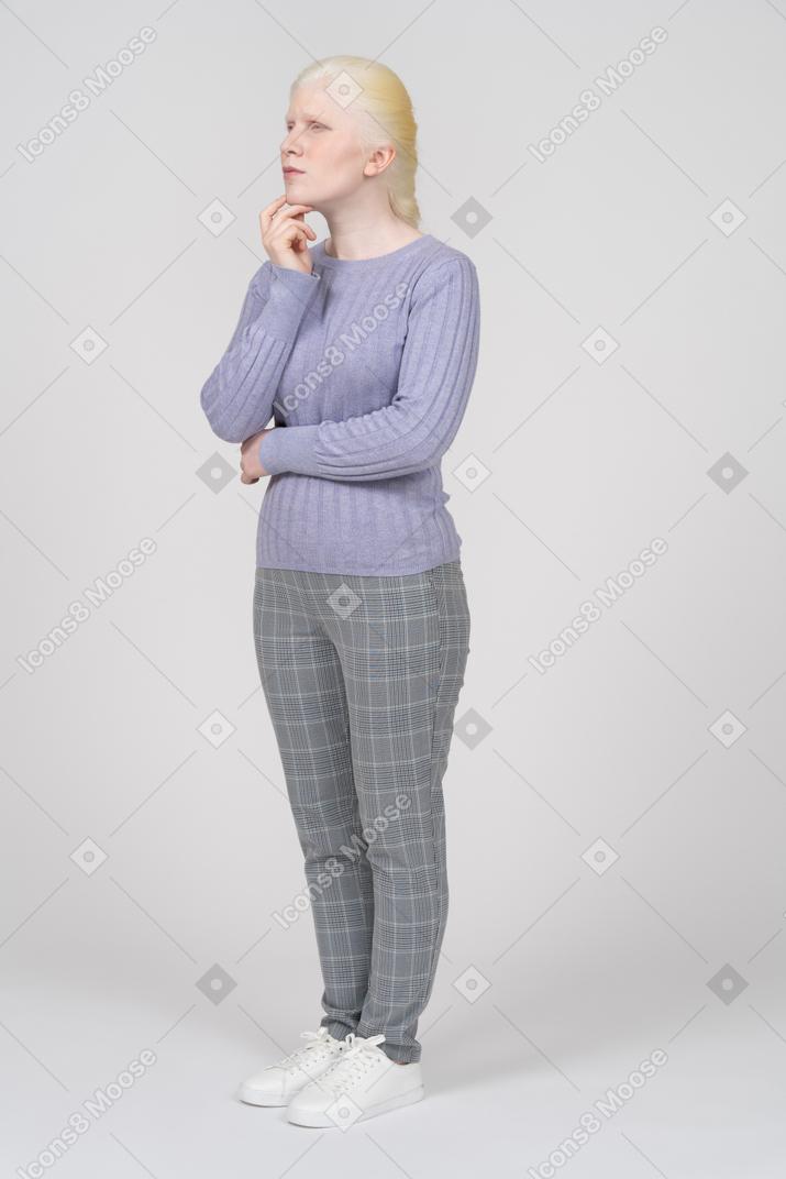 Woman in casual clothes thinking