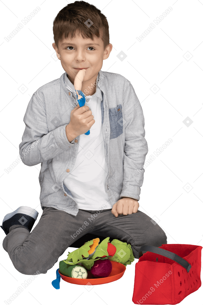 Boy playing with faux food