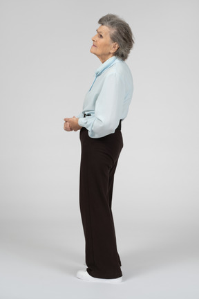 Side view of an elderly woman looking up