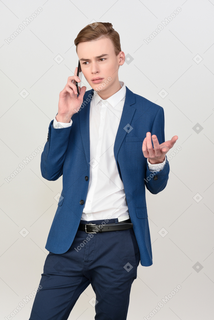 Handsome young man talking on the phone