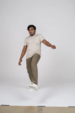 Man in casual clothes posing