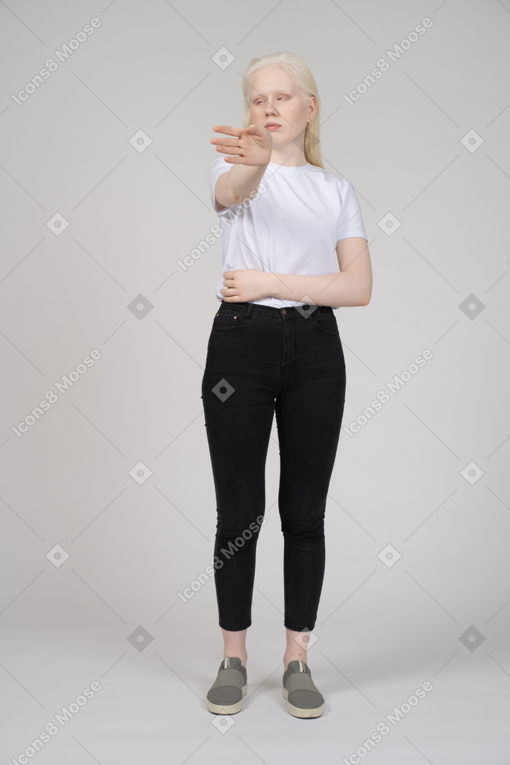 Young woman in casual clothes gesturing