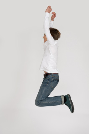 Young man in casual clothes jumping