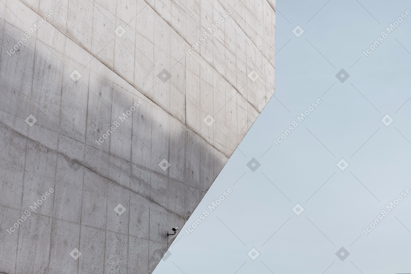 Blue sky and a concrete wall