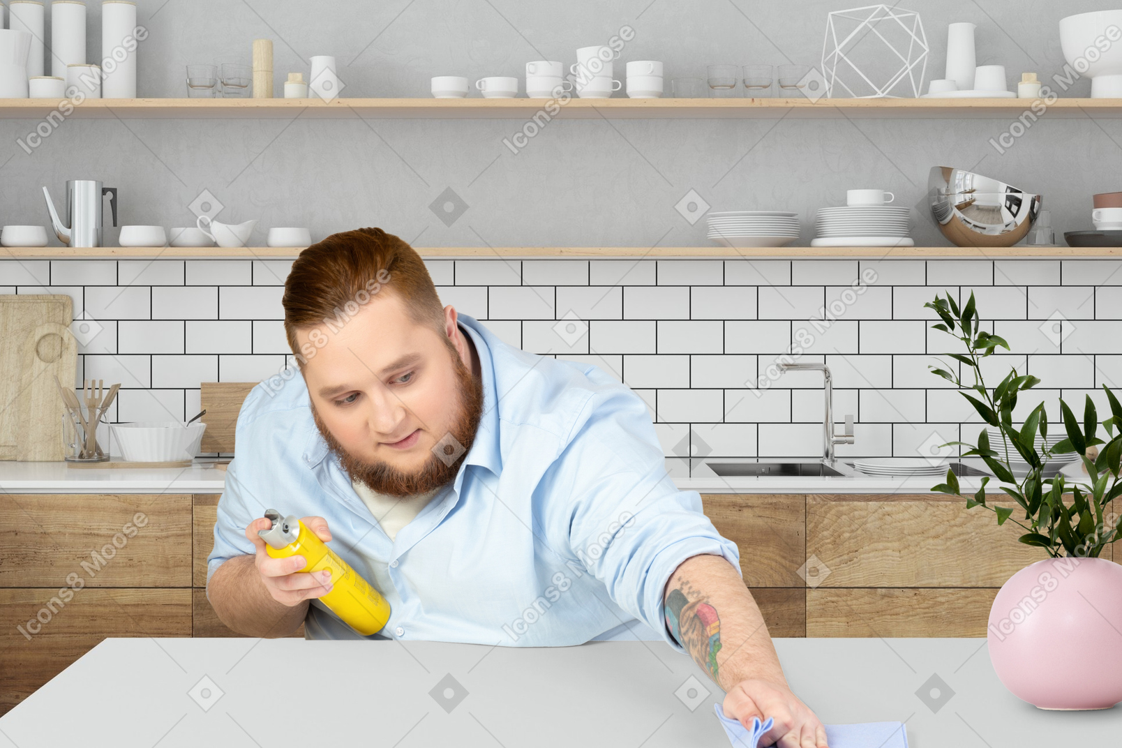 A man in a blue shirt is cleaning a table