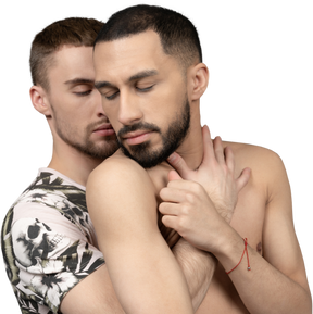 Close-up of a young man back hugging his shirtless lover