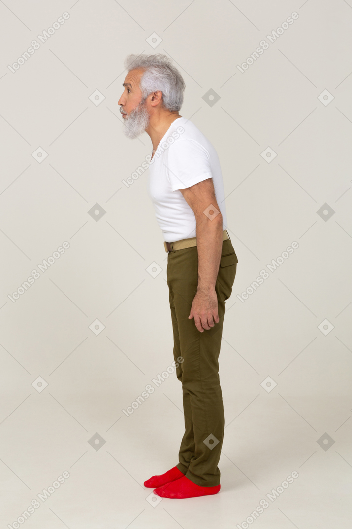 Side view of a man leaning forward