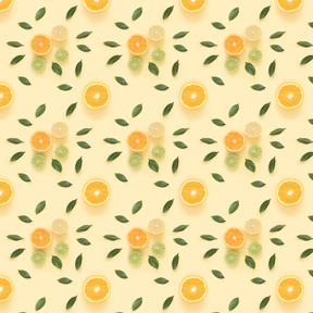 Citrus slices and green leaves over pastel background