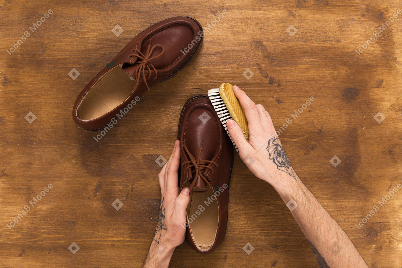 Male leather shoes on wooden background