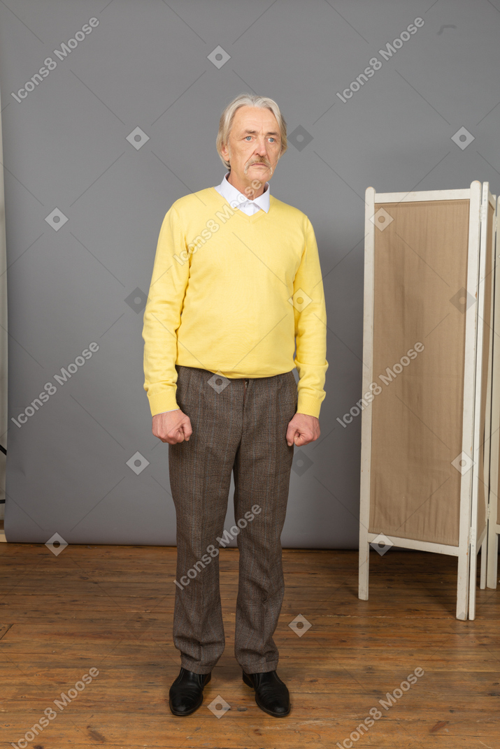 Front view of a serious old man looking aside