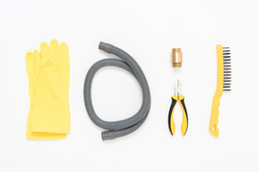 A set of plumbing tools arranged neatly on the white background