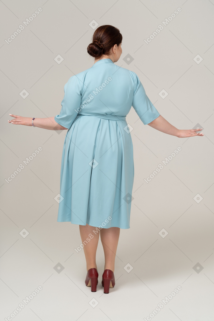 Rear view of a woman in blue dress