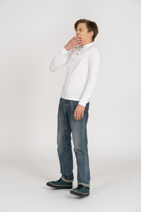 Young man in casual clothes standing