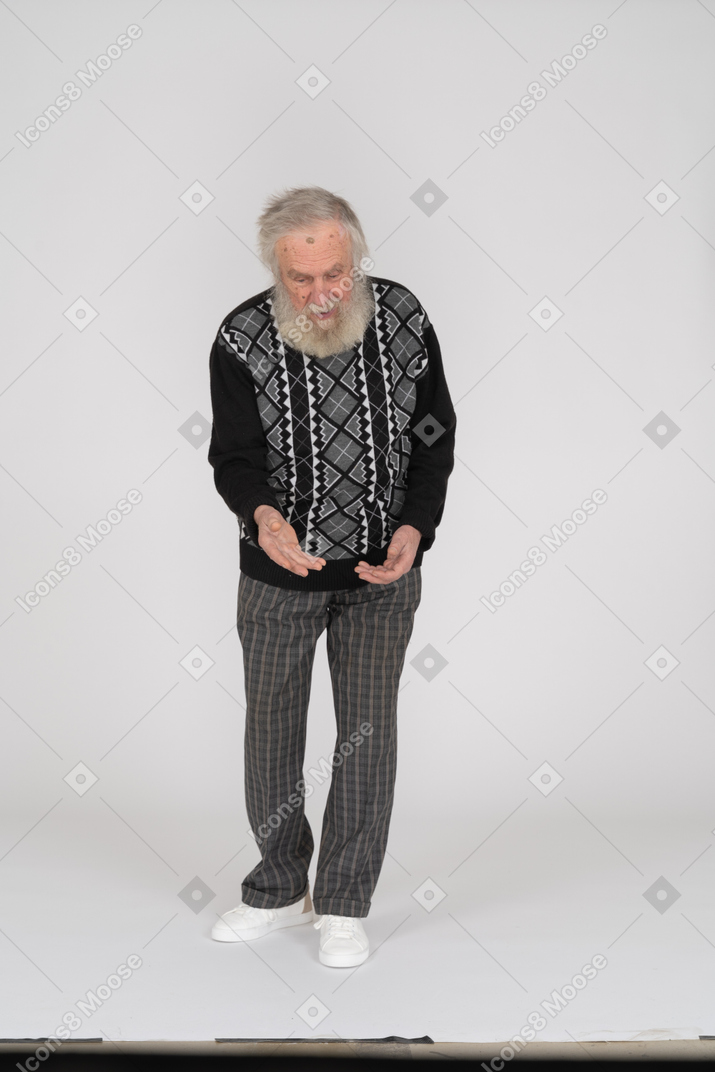 Front view of an old man leaning forward with hands out
