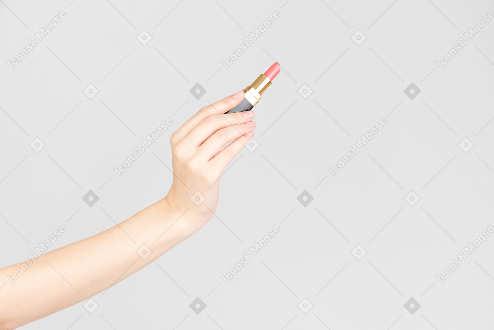 Female hand holding pink lipstick