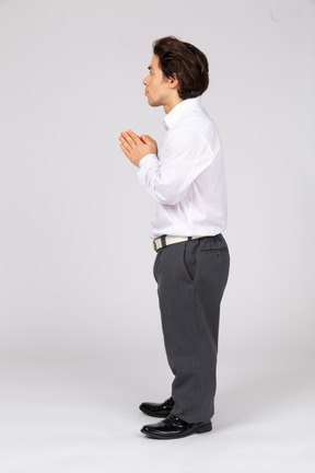 Male office worker with folded hands