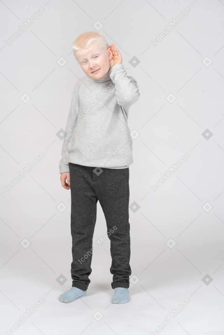 Front view of a boy eavesdropping