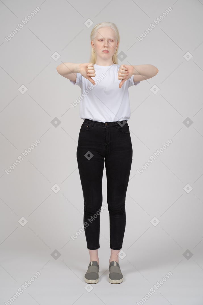 Front view of a young girl with two thumbs down