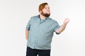 A fat man shaking his fist at someone