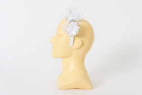 White hairband with a bow on a mannequin head