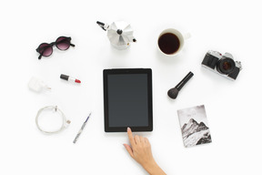 Female hand switching on a digital tablet