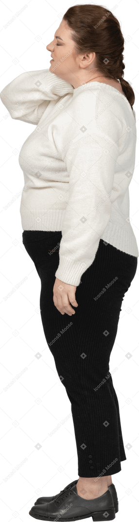 Plump woman in white sweater suffering from pain in neck