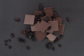 Crashed chocolate with raisins on the black