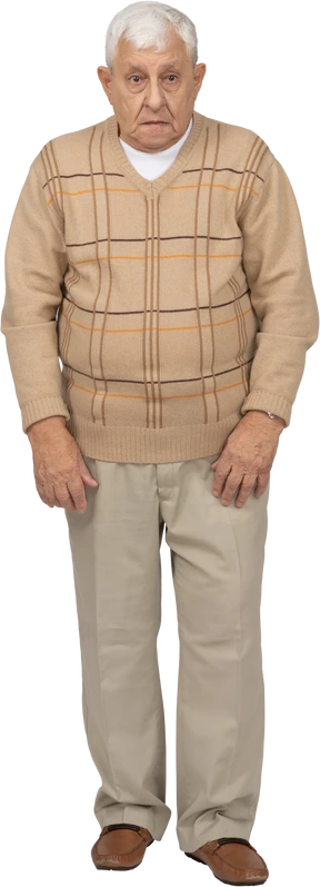 Front view of an impressed old man in casual clothes looking at camera