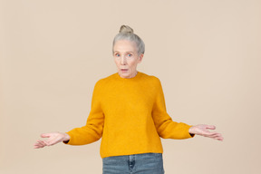 Elegant older woman looking surprised