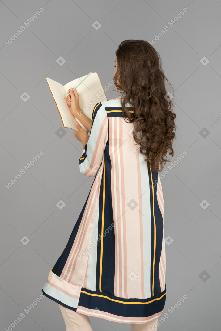 Young woman going through her notes