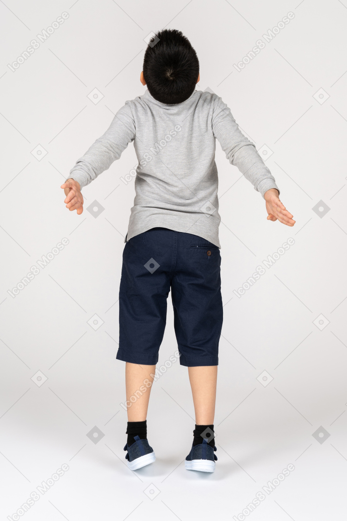 Boy with spread arms
