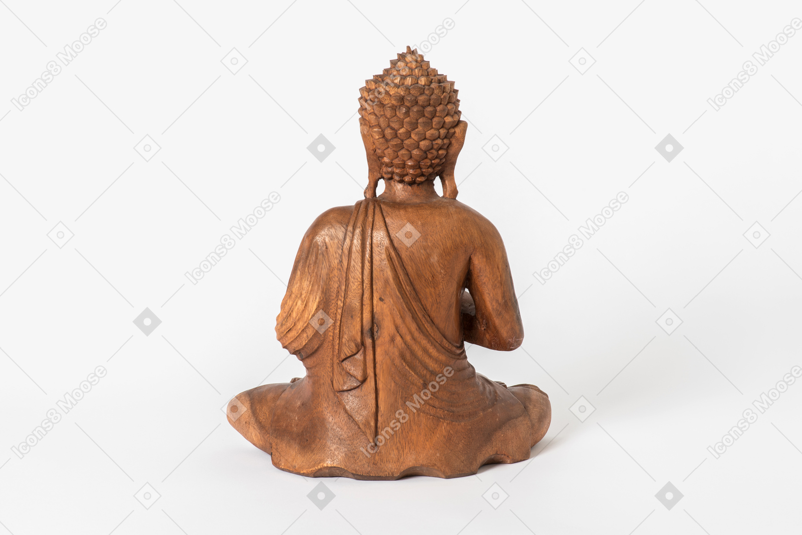 Buddha statue placed back half sideways on white background