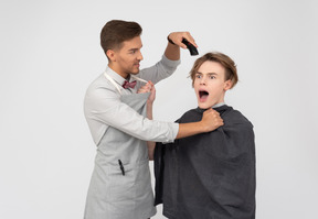 A young barber and his client