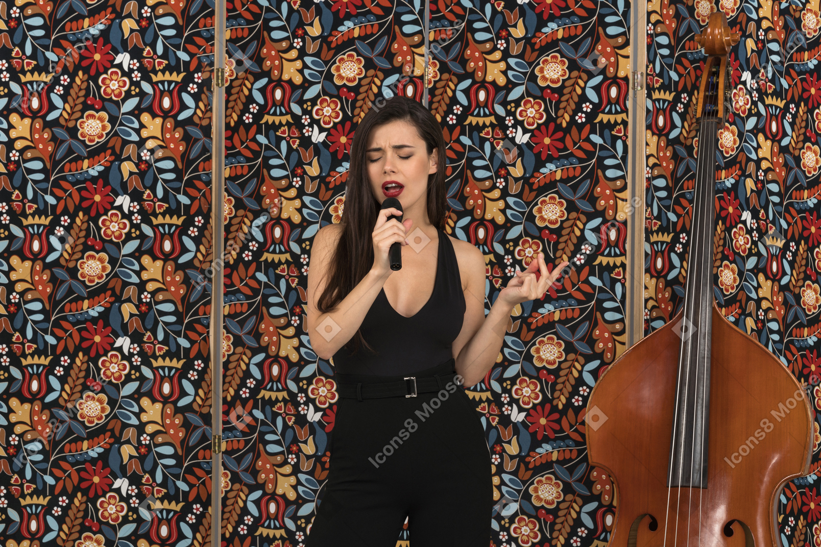 Sensual young female singing with her eyes closed