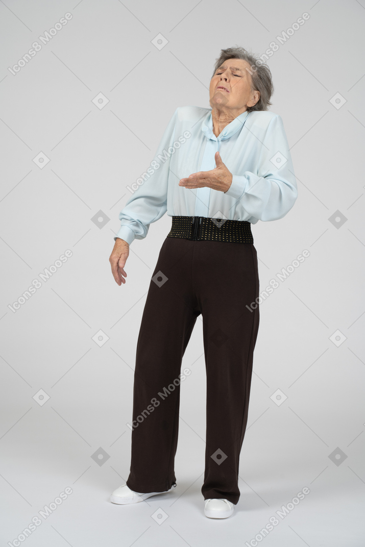 Front view of old woman gesturing
