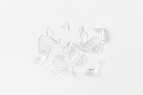 Broken glass pieces on white background