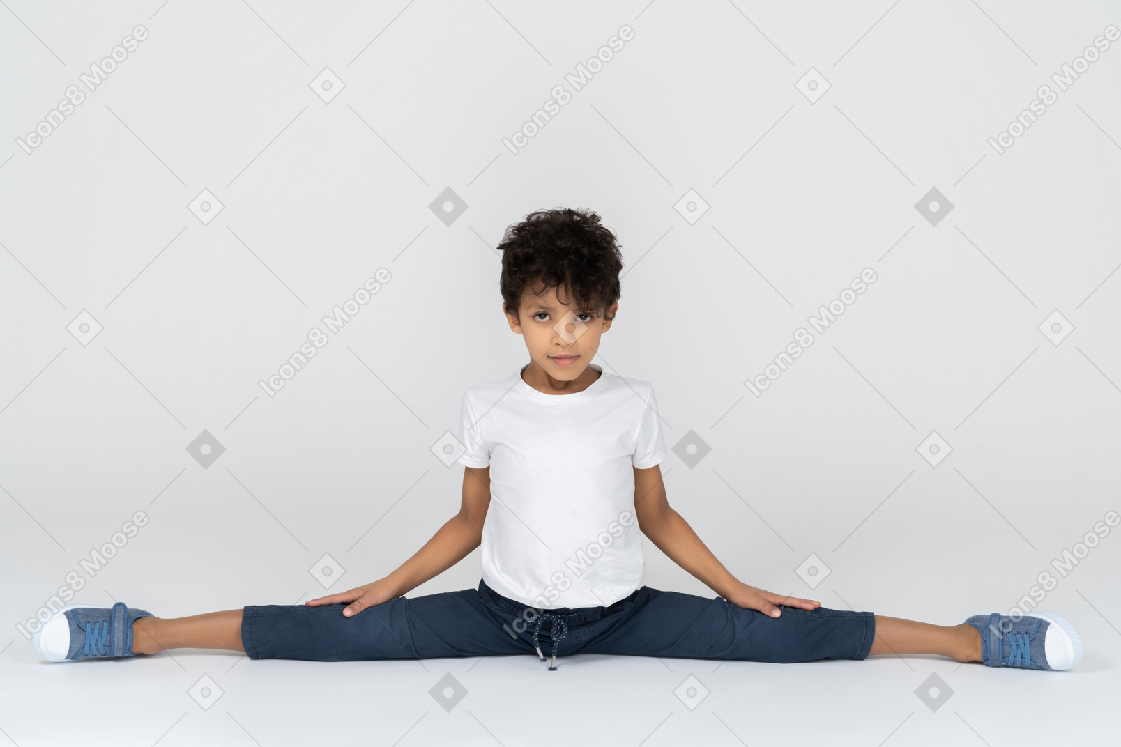 A boy doing split exercise