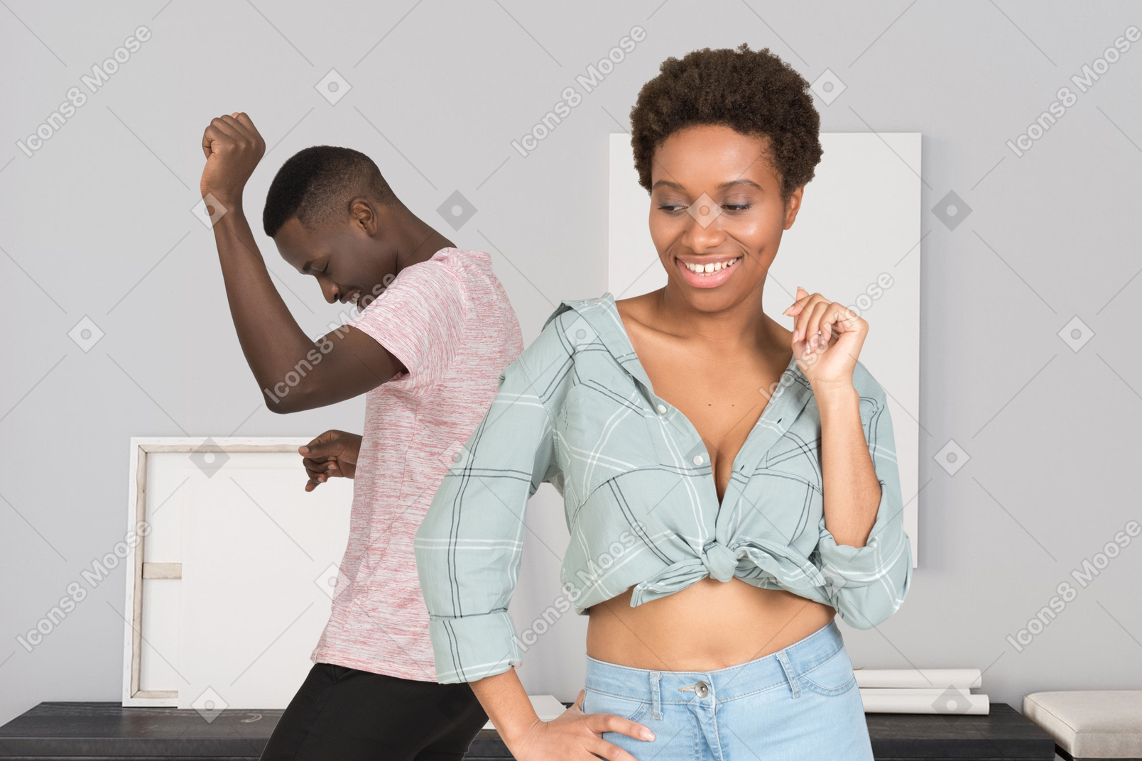 A woman and a man dancing in a room
