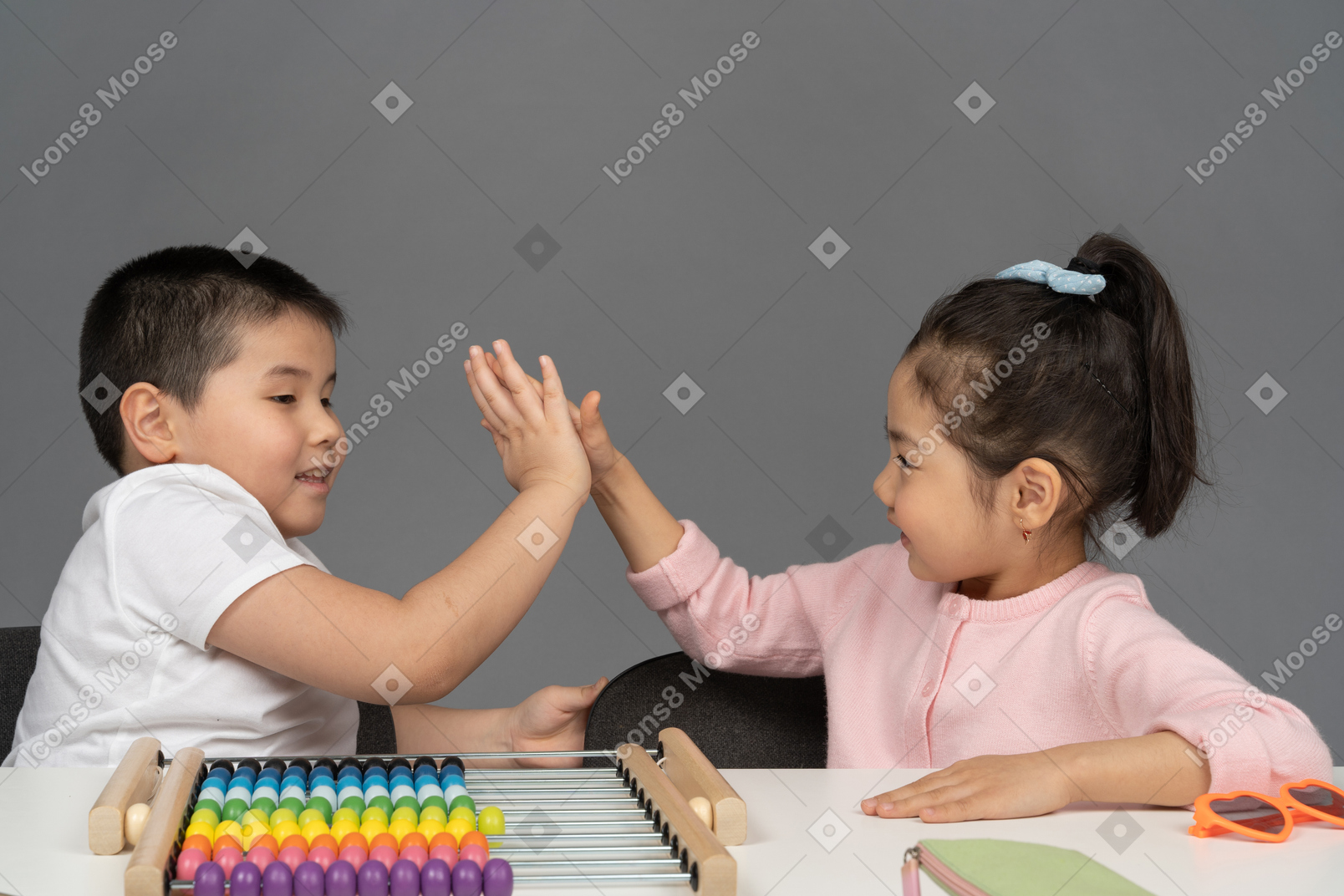 kids giving high fives