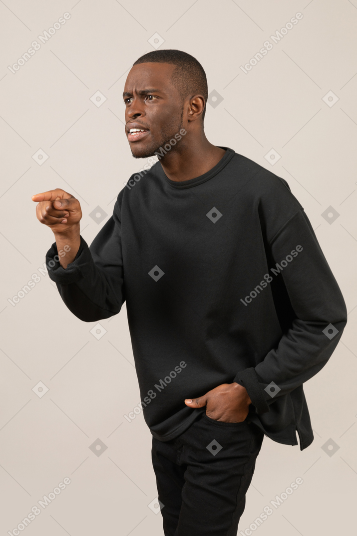 Young man arguing and gesturing