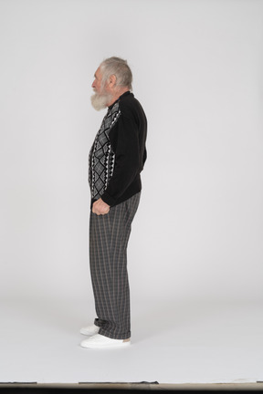 Side view of an old man in casual clothes looking away